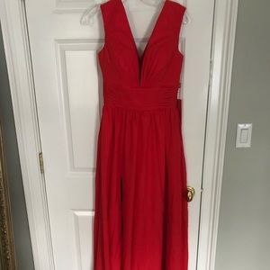 Red v-neck prom dress with a leg slit